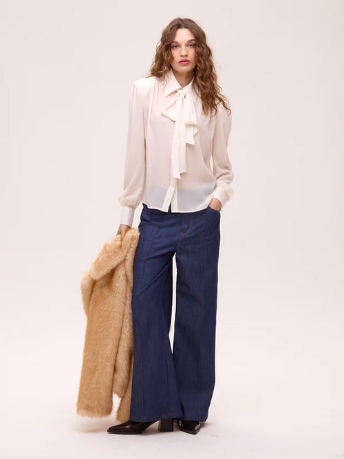 Allure camisa blanca.